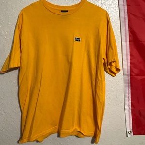 yellow “obey” shirt